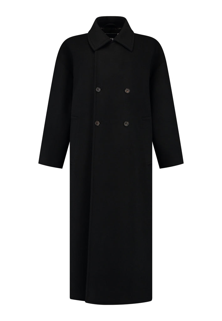 This long, oversized coat is crafted from a luxurious cashmere-wool blend, designed to keep you both warm and stylish. Don’t miss the interior pocket finished with our couture zipper, and the ‘We Should Kiss’ mantra inside, a reminder to embrace kindness. This coat offers a cool, sophisticated look, perfect for pairing with everything from evening dresses to denim, making it a versatile statement piece you’ll want to wear everywhere.