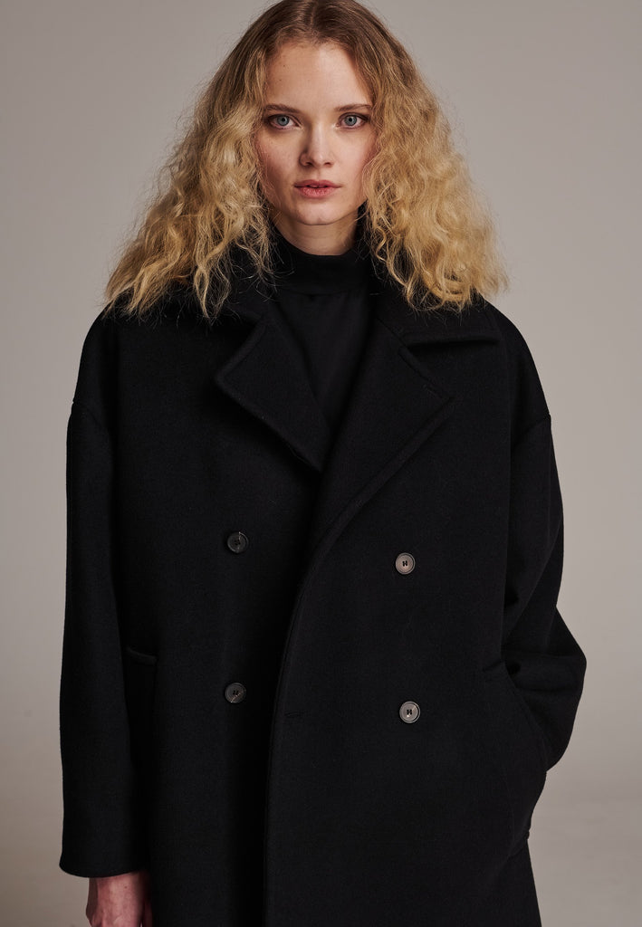 This long, oversized coat is crafted from a luxurious cashmere-wool blend, designed to keep you both warm and stylish. Don’t miss the interior pocket finished with our couture zipper, and the ‘We Should Kiss’ mantra inside, a reminder to embrace kindness. This coat offers a cool, sophisticated look, perfect for pairing with everything from evening dresses to denim, making it a versatile statement piece you’ll want to wear everywhere.