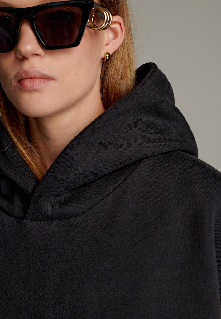 The Hood Jumper combines modern streetwear aesthetics with ultimate comfort. This oversized sleeveless design features a relaxed silhouette with a generously sized hood for added edge. Crafted from soft, premium fabric, it offers a versatile layering option or a stand-alone statement piece.