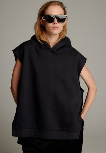 The Hood Jumper combines modern streetwear aesthetics with ultimate comfort. This oversized sleeveless design features a relaxed silhouette with a generously sized hood for added edge. Crafted from soft, premium fabric, it offers a versatile layering option or a stand-alone statement piece.