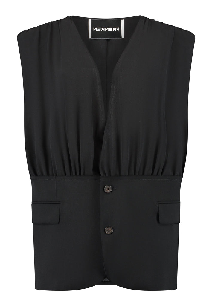 Oversized sleeveless jacket with unique features. Below you see a normal blazer, above you see a sophisticated wrinkled effect top. Detailed with padded shoulders and horn button closure.