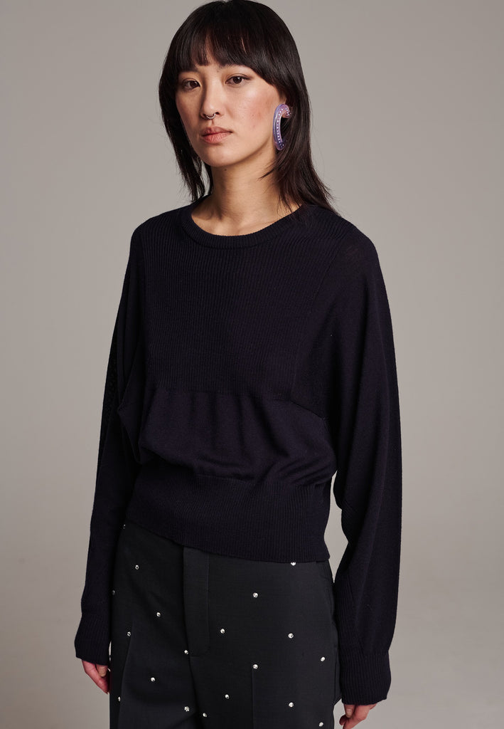 Sweater, crafted from luxurious virgin merino wool that gives a soft handle. Detailed with dropped shoulders, ribbed effect and batwing sleeves. Designed for a loose fit. Long in sleeves. This piece ensures you’ll stay snug and chic, even on the coldest days.