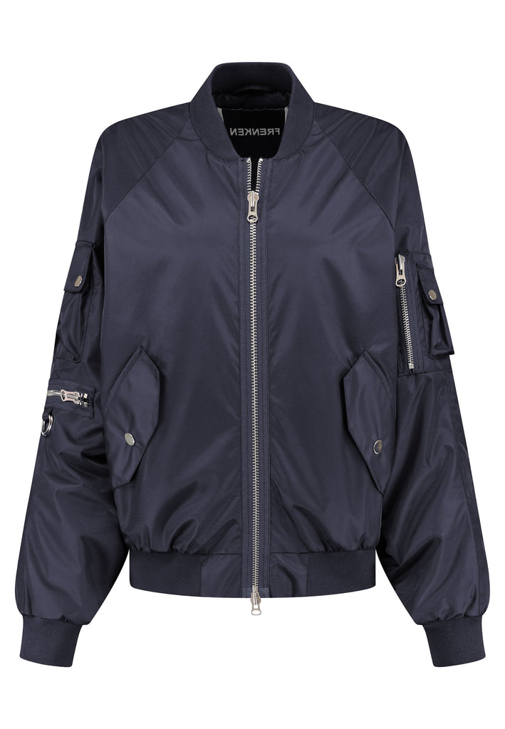 Our short bomber jacket maintains its oversized fit, crafted from crisp nylon in a deep navy blue. Adorned with silver hardware and zippers, this jacket adds a touch of edge to any outfit. Whether styled with tailored pants or a long skirt, it effortlessly enhances your look with a cool, contemporary flair.