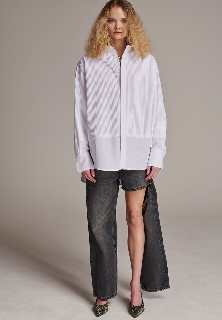 Oversized tuxedo shirt. Loved for its easy elegance, FRENKEN often updates its men-inspired shirts in different fabrics and finishes. This one is cut from tuxedo pleated cotton poplin and has a very oversized loose shape. The styling possibilities are endless - it's truly a must-have.