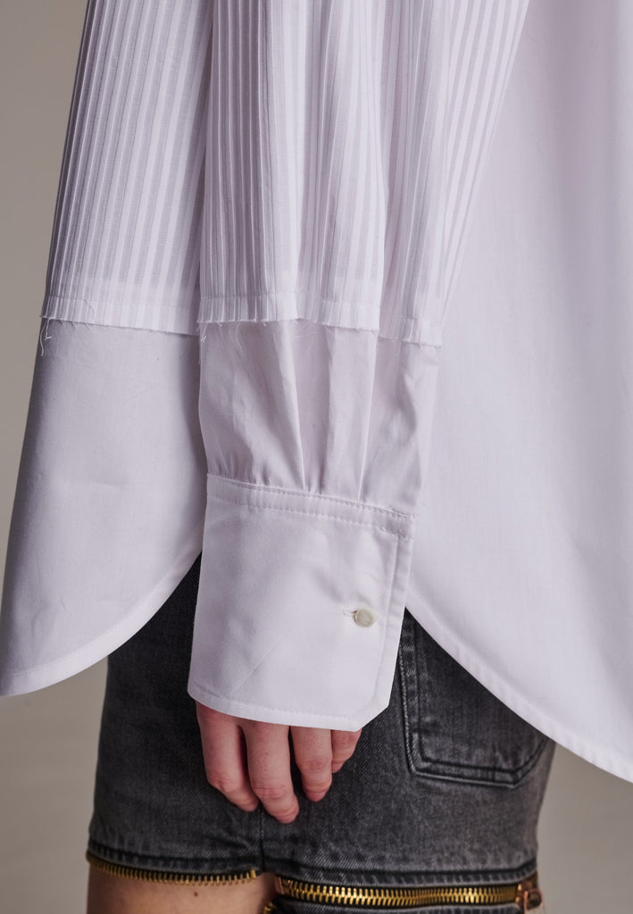 Oversized tuxedo shirt. Loved for its easy elegance, FRENKEN often updates its men-inspired shirts in different fabrics and finishes. This one is cut from tuxedo pleated cotton poplin and has a very oversized loose shape. The styling possibilities are endless - it's truly a must-have.