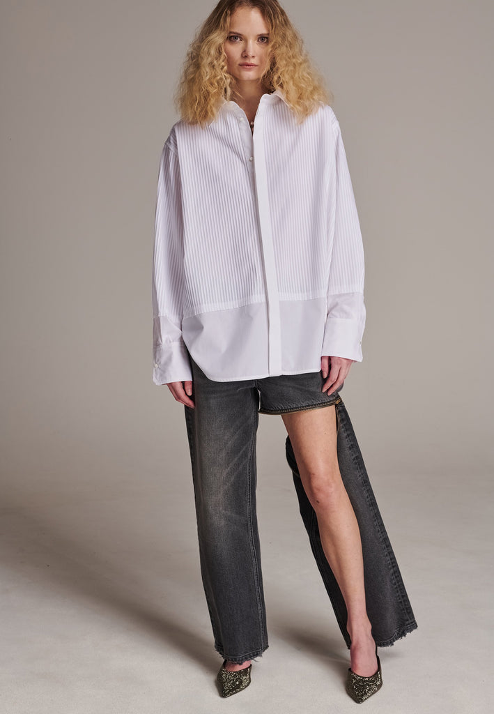 Oversized tuxedo shirt. Loved for its easy elegance, FRENKEN often updates its men-inspired shirts in different fabrics and finishes. This one is cut from tuxedo pleated cotton poplin and has a very oversized loose shape. The styling possibilities are endless - it's truly a must-have.