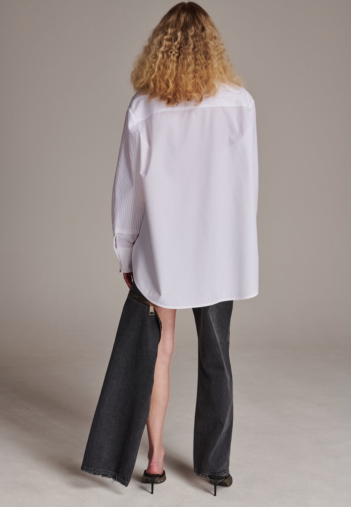 Oversized tuxedo shirt. Loved for its easy elegance, FRENKEN often updates its men-inspired shirts in different fabrics and finishes. This one is cut from tuxedo pleated cotton poplin and has a very oversized loose shape. The styling possibilities are endless - it's truly a must-have.