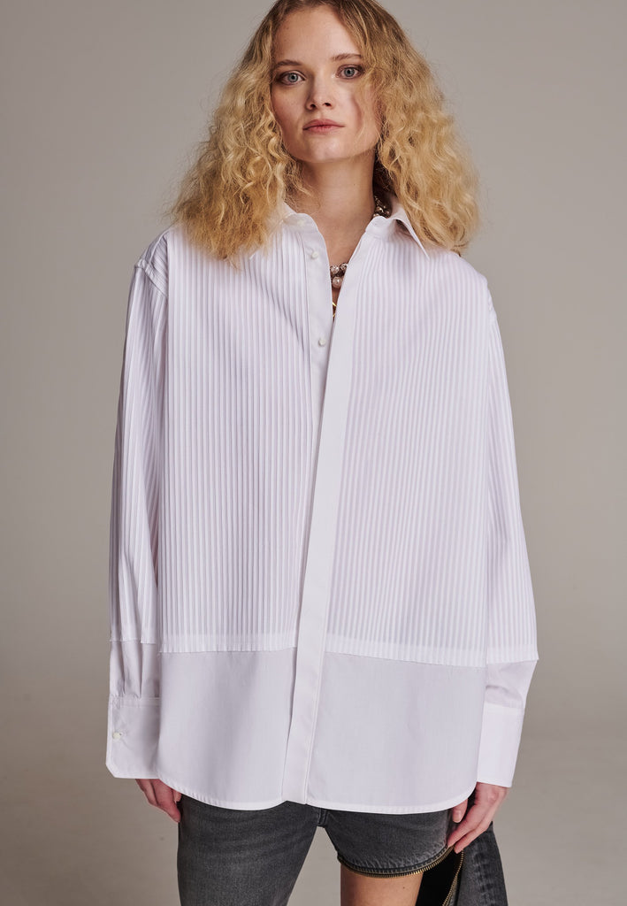 Oversized tuxedo shirt. Loved for its easy elegance, FRENKEN often updates its men-inspired shirts in different fabrics and finishes. This one is cut from tuxedo pleated cotton poplin and has a very oversized loose shape. The styling possibilities are endless - it's truly a must-have.