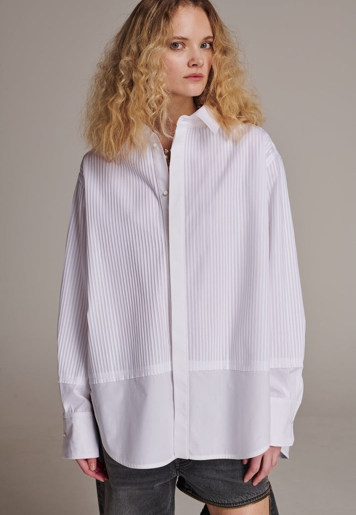 Oversized tuxedo shirt. Loved for its easy elegance, FRENKEN often updates its men-inspired shirts in different fabrics and finishes. This one is cut from tuxedo pleated cotton poplin and has a very oversized loose shape. The styling possibilities are endless - it's truly a must-have.