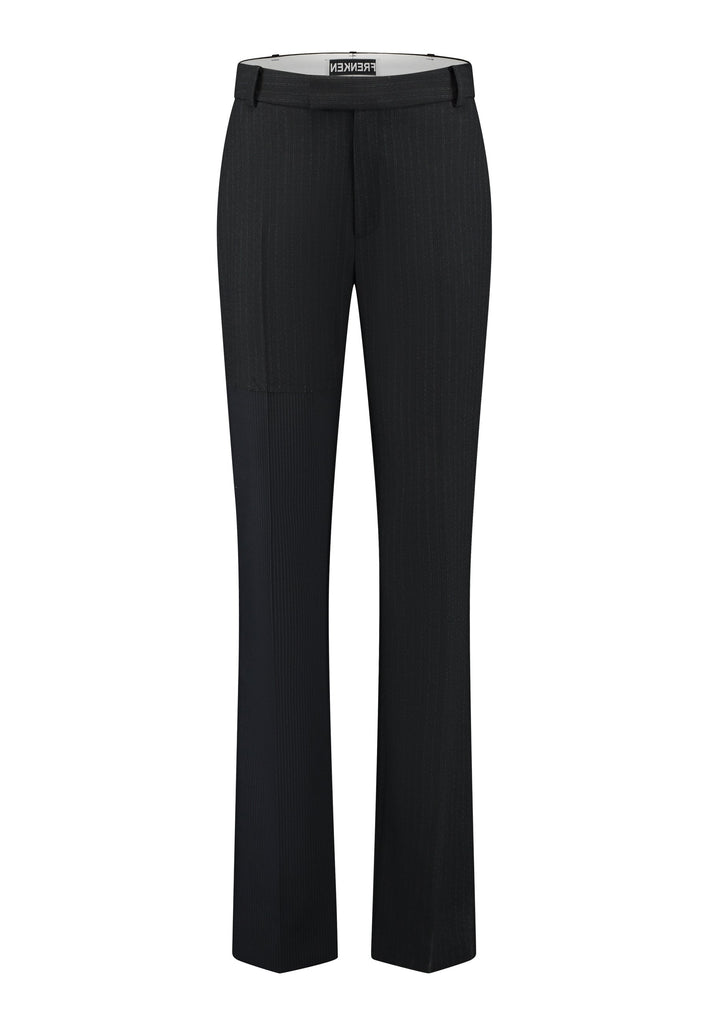 This straight-fitted pant, inspired by a masculine fit, features a subtle surprise: one leg crafted from a different fabric, noticeable only to the discerning eye. These trousers elongate the legs and can be worn as part of a sharp, complete suit. Style them casually with a T-shirt or an oversized shirt with rolled-up sleeves and an open front for a more relaxed, effortless look.