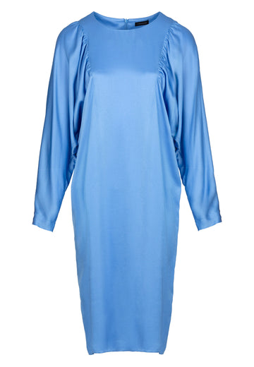 Image of fast dress, sky color. Soft satin midi dress with sculptural billowy sleeves and nips in flatteringly. Made in a fresh and vibrant sky blue. This satin drapes beautifully and has a slim silhouette.