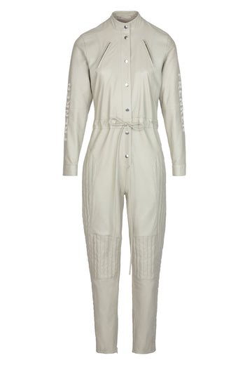 Flaneur jumpsuit, sand color. Leather jumpsuit detailed with covered press buttons and logo on the sleeve. frenkenfashion.com