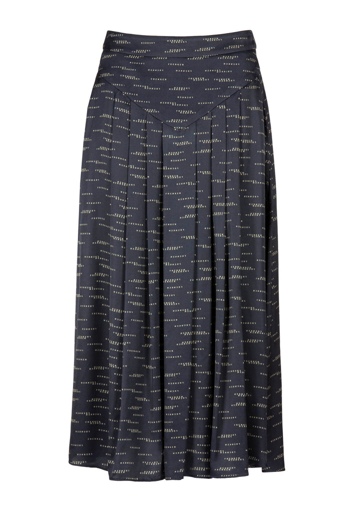 Wick | Skirt | Logo Print Navy. 100% Viscose. Wick, cut from a smooth viscose satin, customized with FRENKEN exclusive print, sharply pleated for a beautiful movement. This midi skirt has pockets for a sense of easy wear and can either be styled with a simple jersey and chunky sandals or with high heels for added elegance.