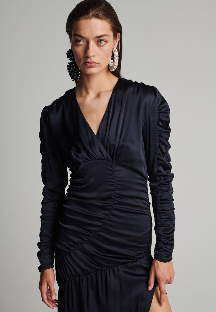 Satin midi dress in navy. Features a v-neck, wrinkled-style hip and arms, and leg opening. True to size.