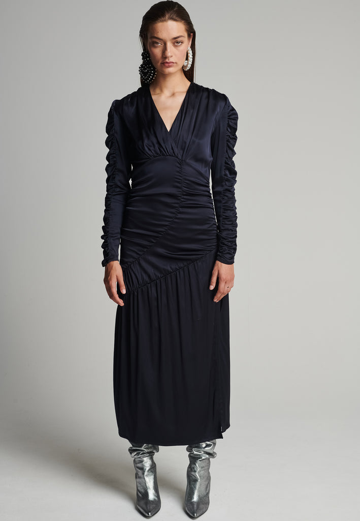 Satin midi dress in navy. Features a v-neck, wrinkled-style hip and arms, and leg opening. True to size.