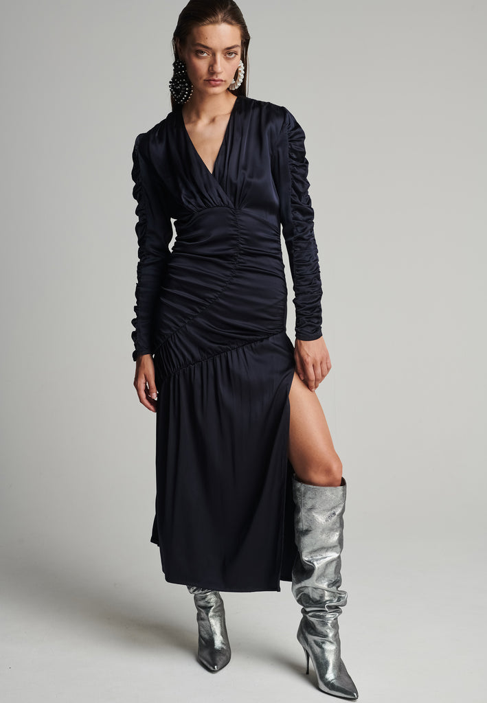 Satin midi dress in navy. Features a v-neck, wrinkled-style hip and arms, and leg opening. True to size.