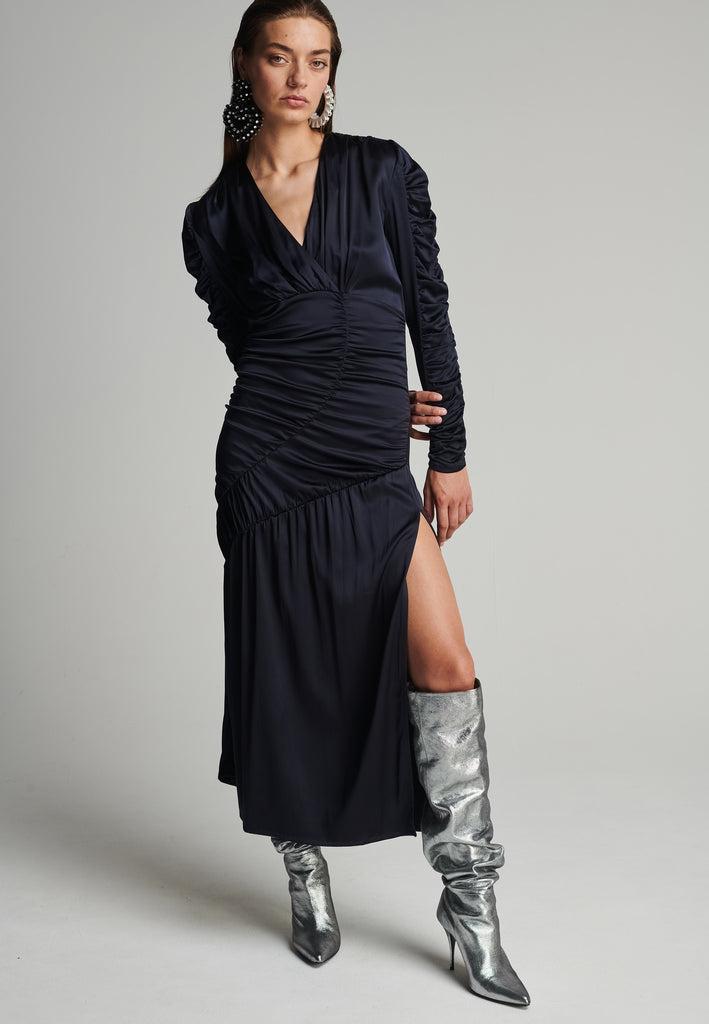 Satin midi dress in navy. Features a v-neck, wrinkled-style hip and arms, and leg opening. True to size.