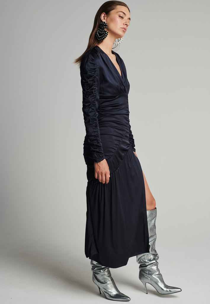 Satin midi dress in navy. Features a v-neck, wrinkled-style hip and arms, and leg opening. True to size.